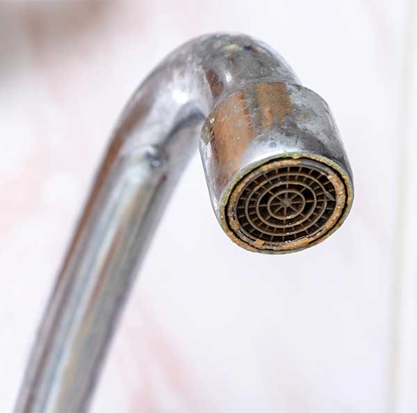 Dirty Faucet with Limescale Deposit