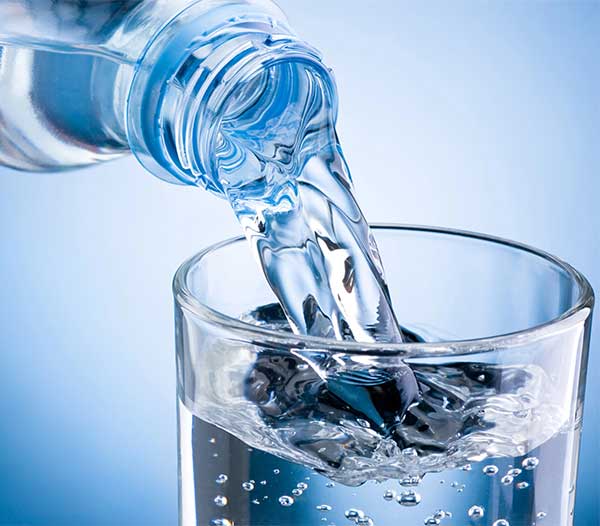 Pouring Clear Water into a Glass