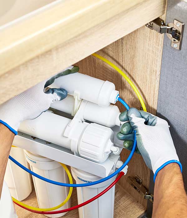 Technician replacing Water Filter Technician replacing Water Filter